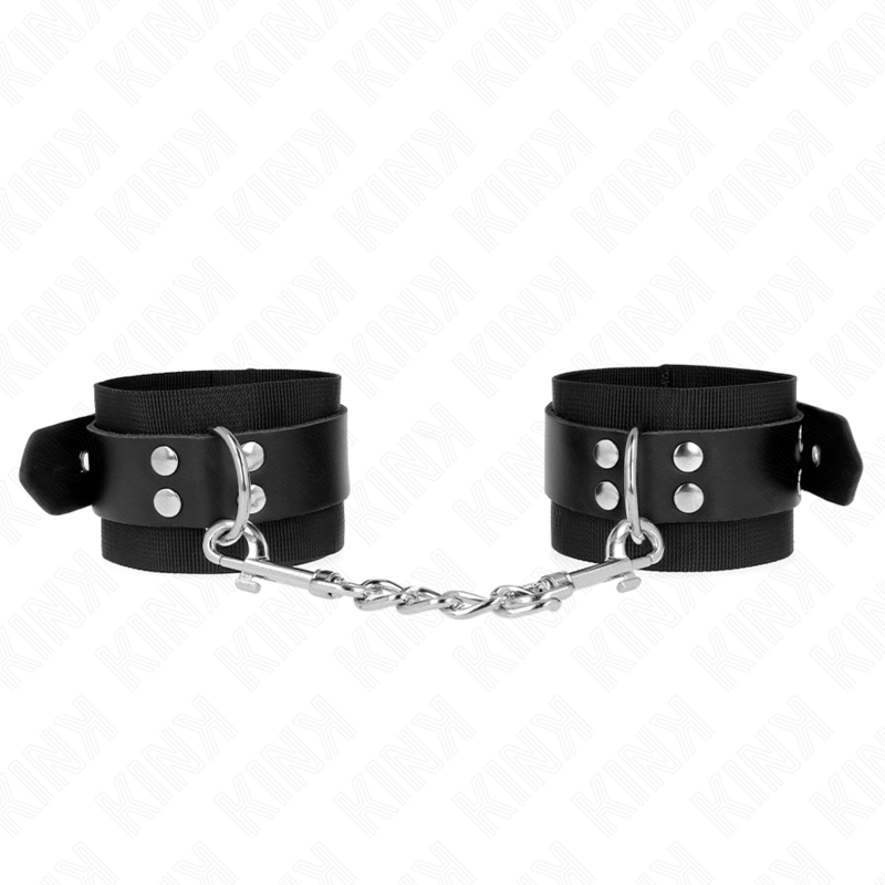 Imagen del artículo erótico KINK - MUÑEQUERAS DE NYLON NEGRO CON CORREA CUERO NEGRO AJUSTABLE 19-29 CM X 5.1 CM de KINK WRIST RESTRAINT en la sección BDSM & BONDAGE |Bondage|Esposas de fijación de Millenial Sexshop.