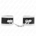 Imagen del artículo erótico KINK - MUÑEQUERAS NEGRO CON ENCAJE DECORATIVO BLANCO AJUSTABLE 20-23 CM X 5.5 CM de KINK WRIST RESTRAINT en la sección BDSM & BONDAGE |Bondage|Esposas de fijación de Millenial Sexshop.