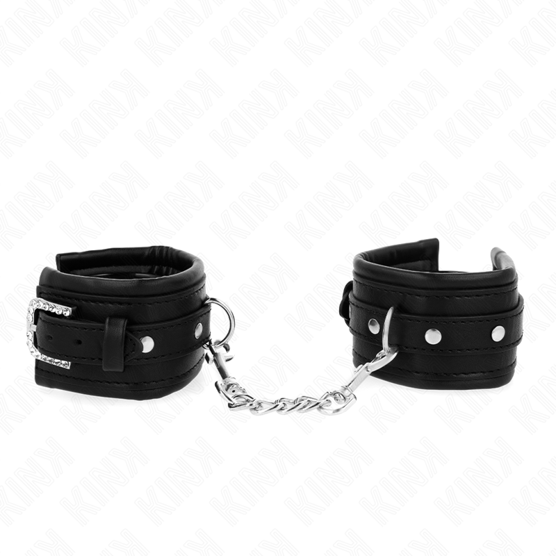 Imagen del artículo erótico KINK - MUÑEQUERAS NEGRO CON HEBILLA DE DIAMANTES DE IMITACIÓN AJUSTABLE 25-32 CM X 5.5 CM de KINK WRIST RESTRAINT en la sección BDSM & BONDAGE |Bondage|Esposas de fijación de Millenial Sexshop.